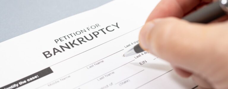 Hand filing a bankruptcy form